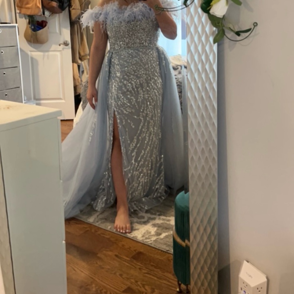 Elegant Silver Sequin Gown with Feather Details